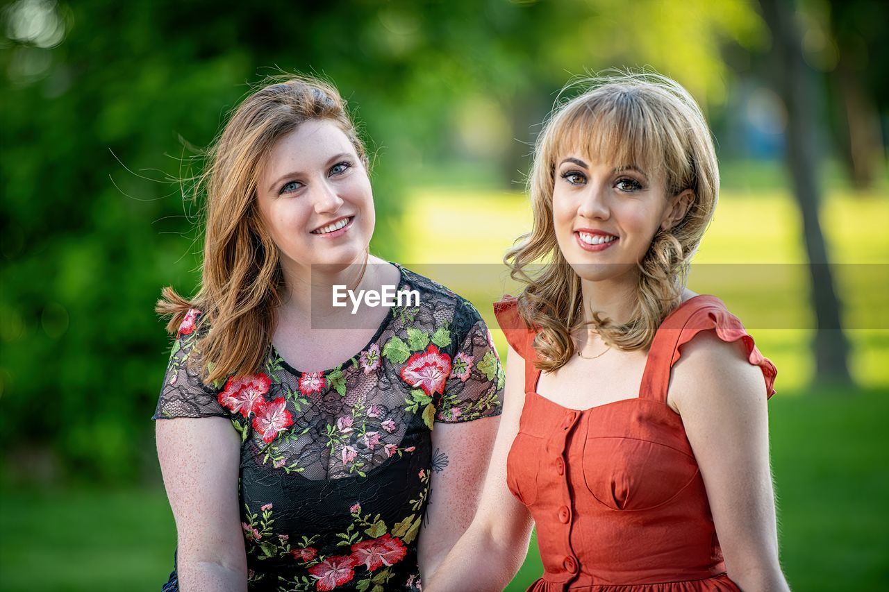 Portrait of smiling young women outdoors