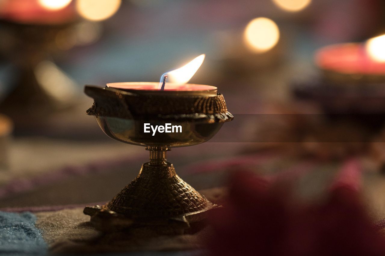 Close-up of illuminated lamp against blurred background