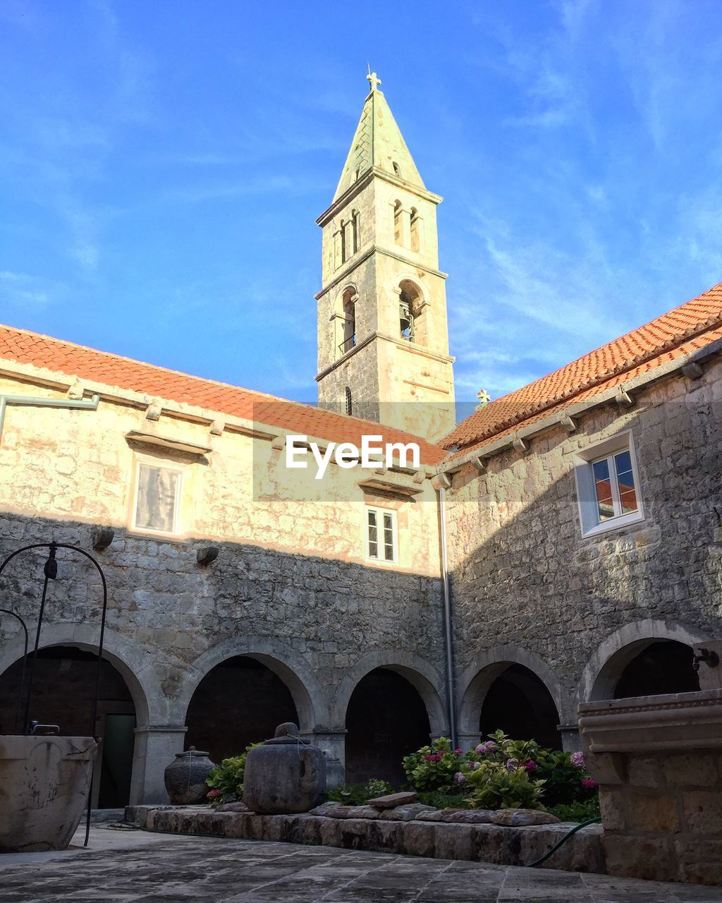 Low angle view of bell tower against sky