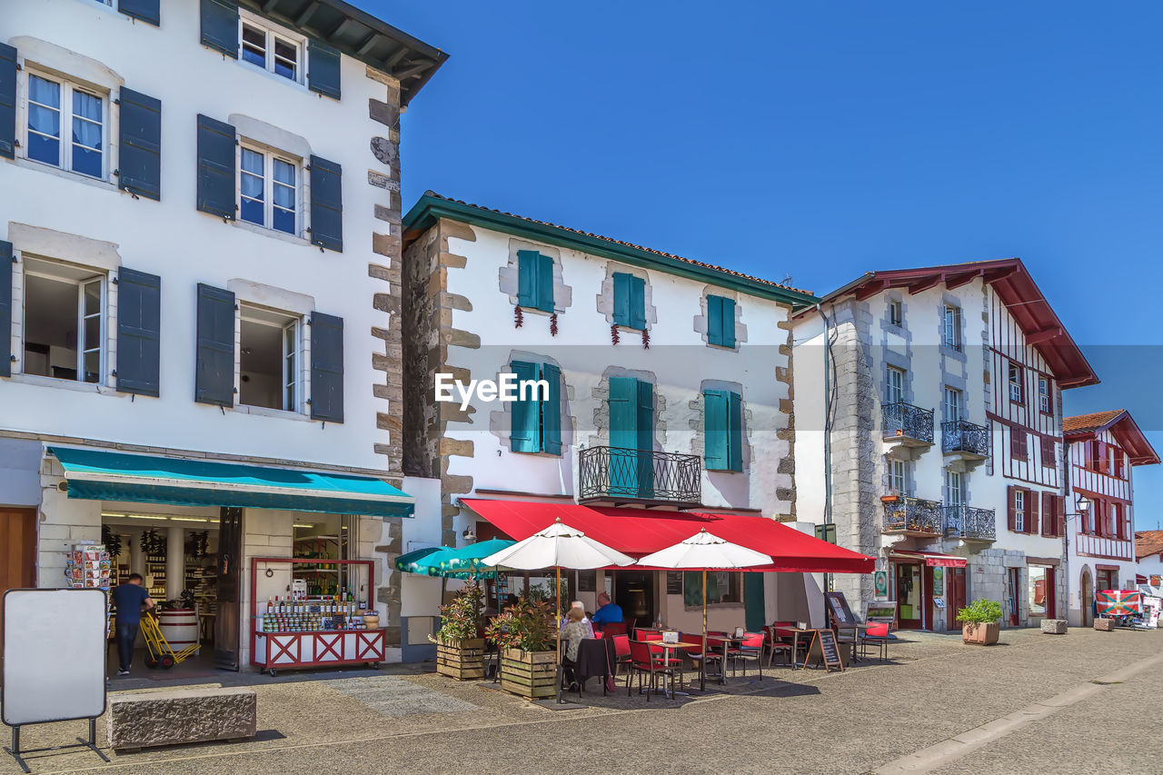 Street with historical houses in espelette, pyrenees-atlantiques, france