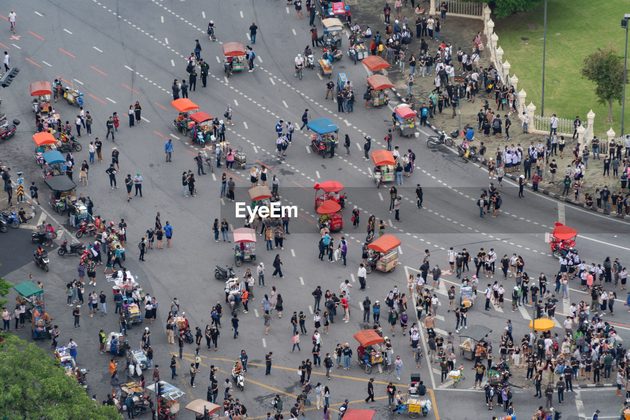 High angle view of protesters on city street during pandemic