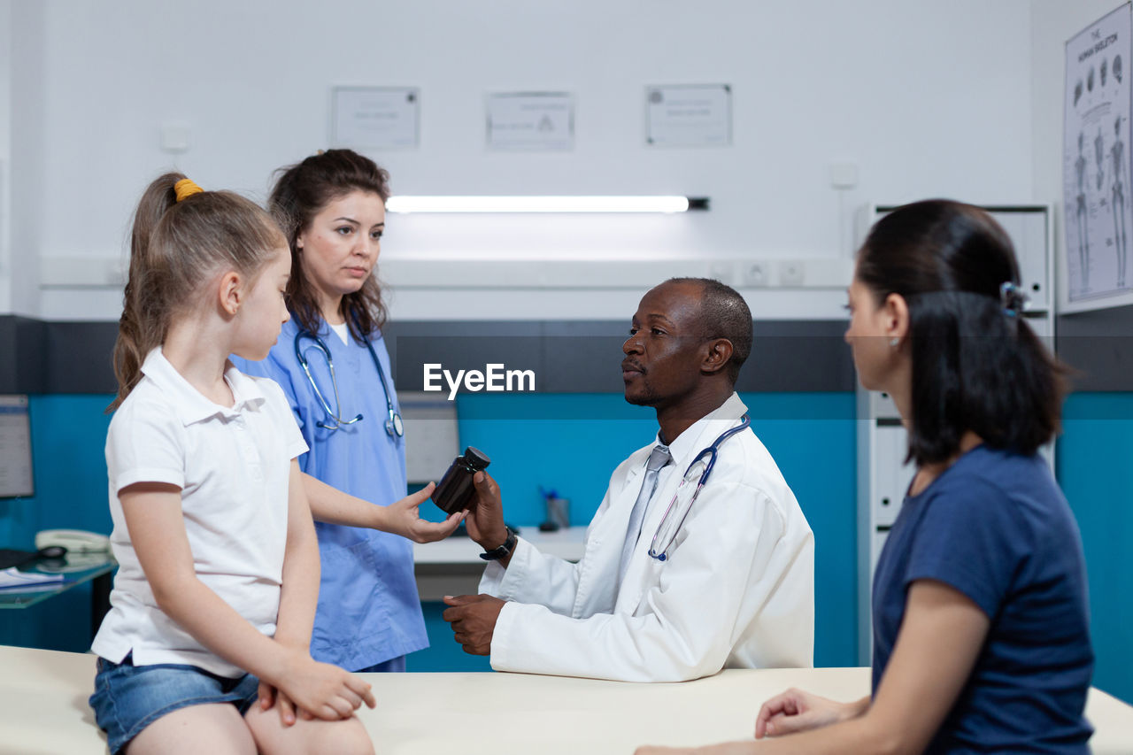 Doctor examining patient at hospital