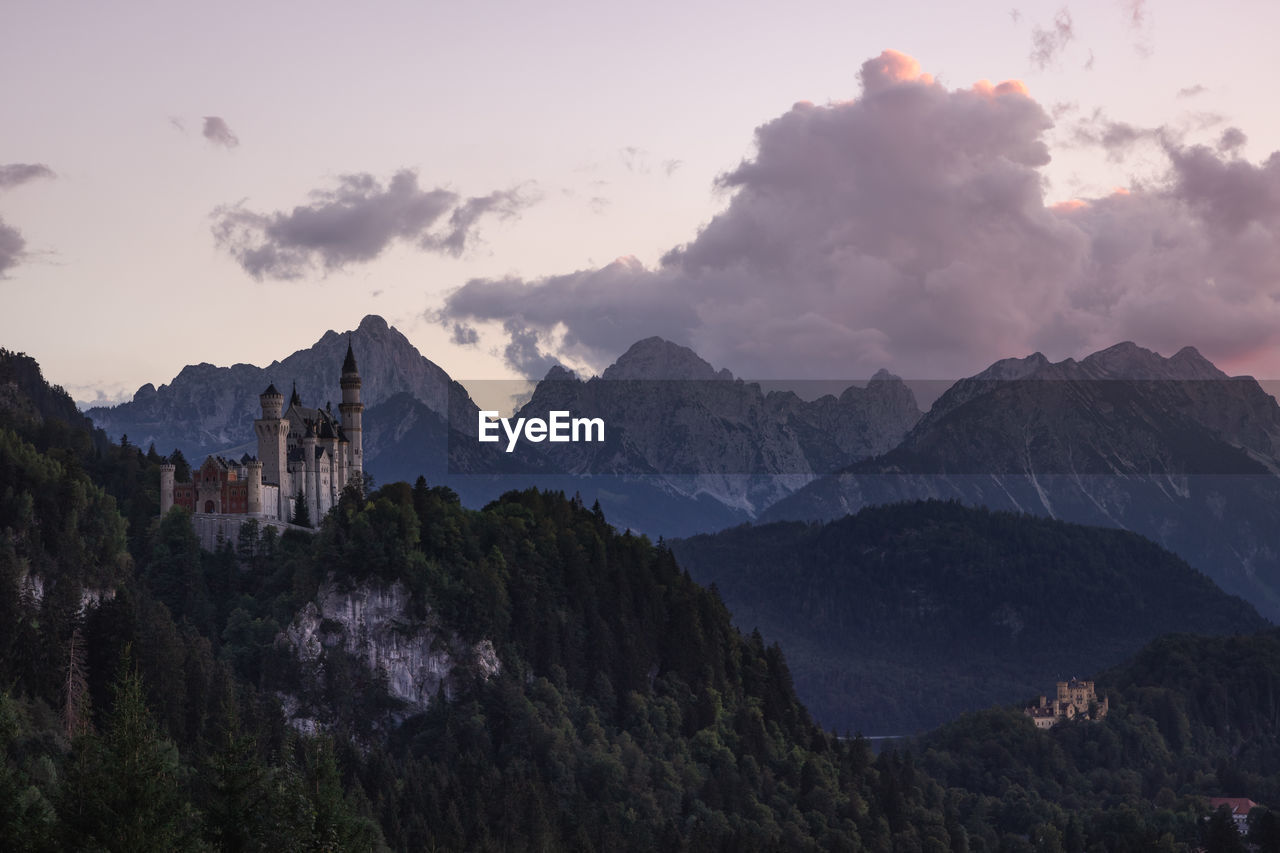 PANORAMIC VIEW OF BUILDINGS IN MOUNTAINS AGAINST SKY