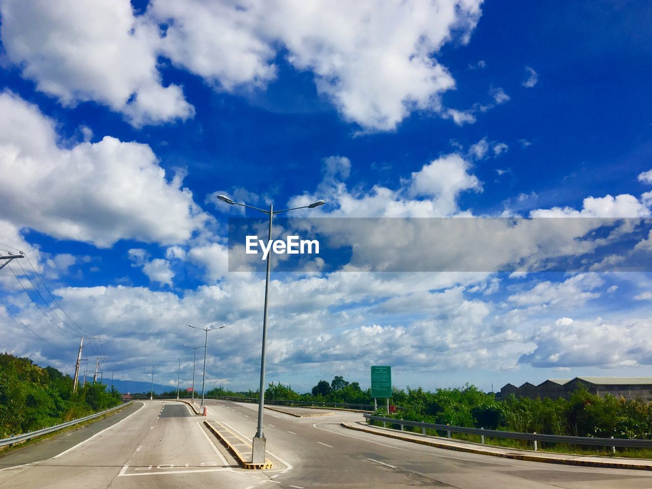 HIGHWAY AGAINST BLUE SKY