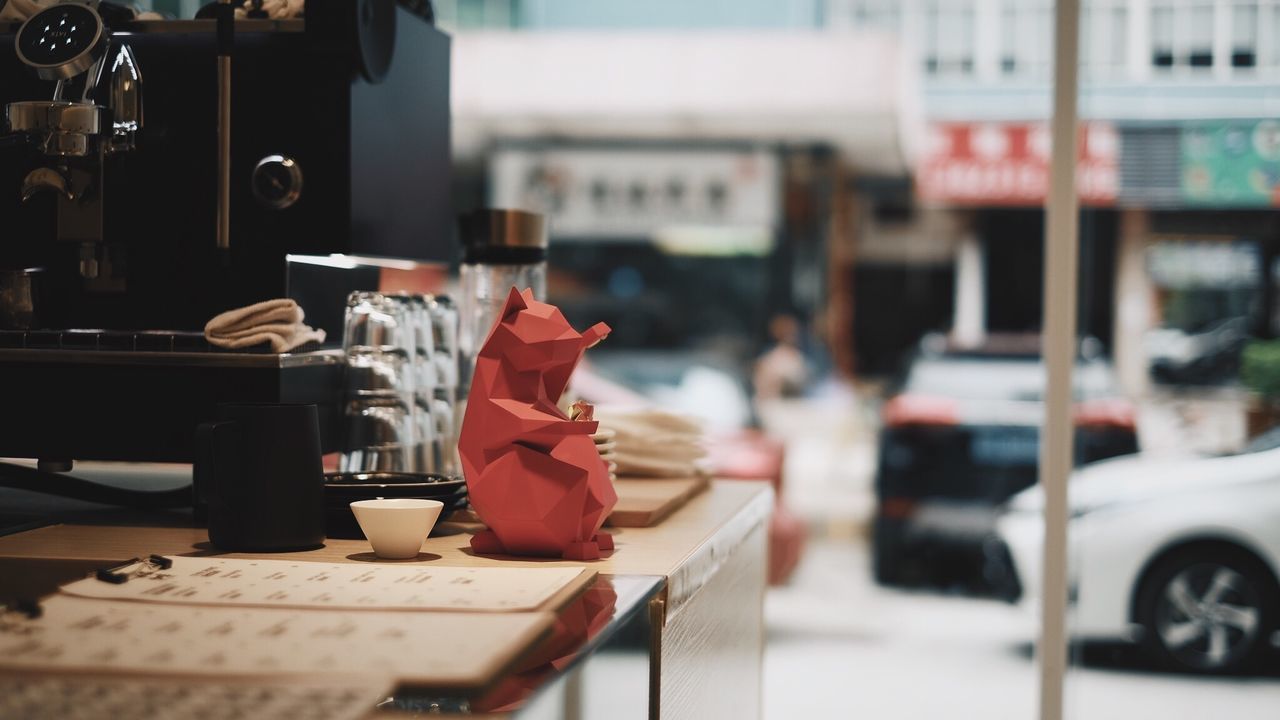 Close-up of sidewalk cafe counter in city