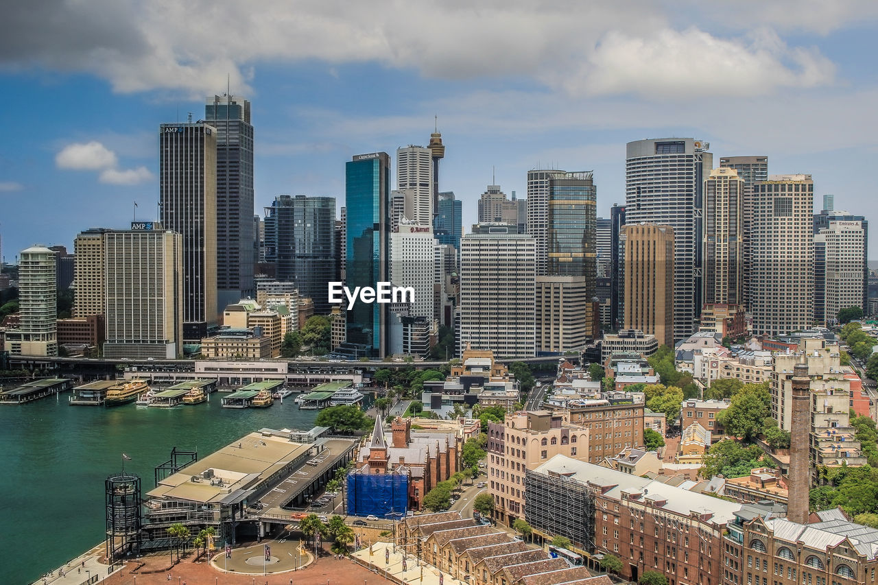 City skyline against cloudy sky