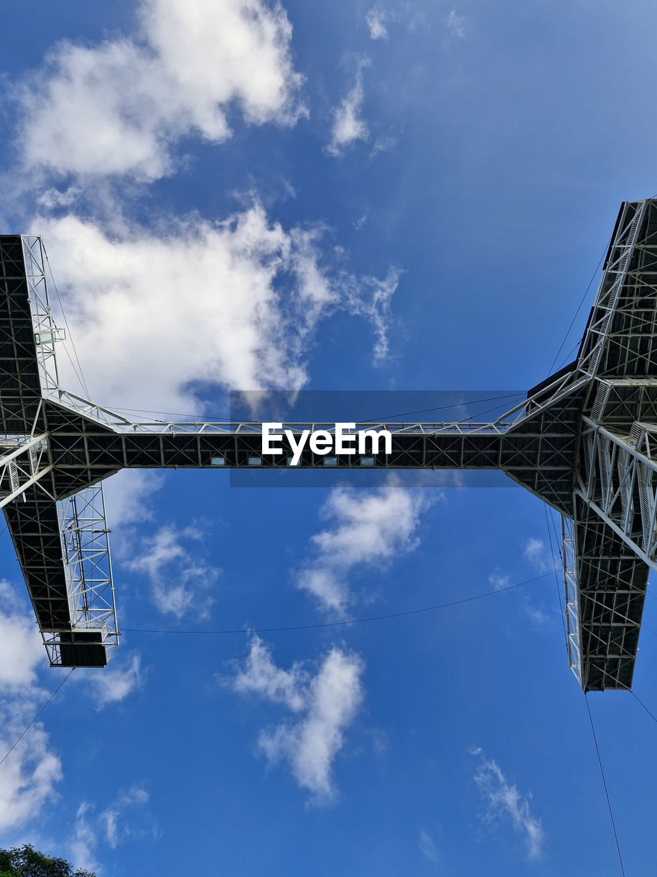 sky, cloud, architecture, built structure, nature, blue, low angle view, city, day, no people, outdoors, transportation, skyscraper, travel, tower, building exterior, wind, technology