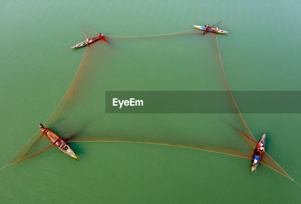 Aerial view of fishing boats in sea