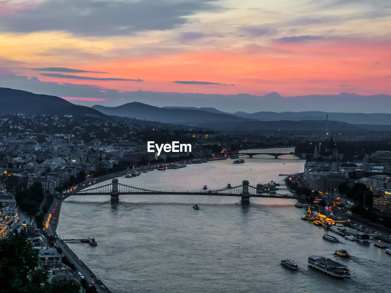 High angle view of bridge over river against sky during sunset