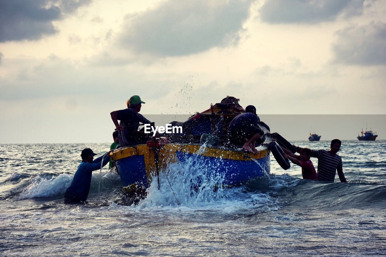 PEOPLE ENJOYING WATER