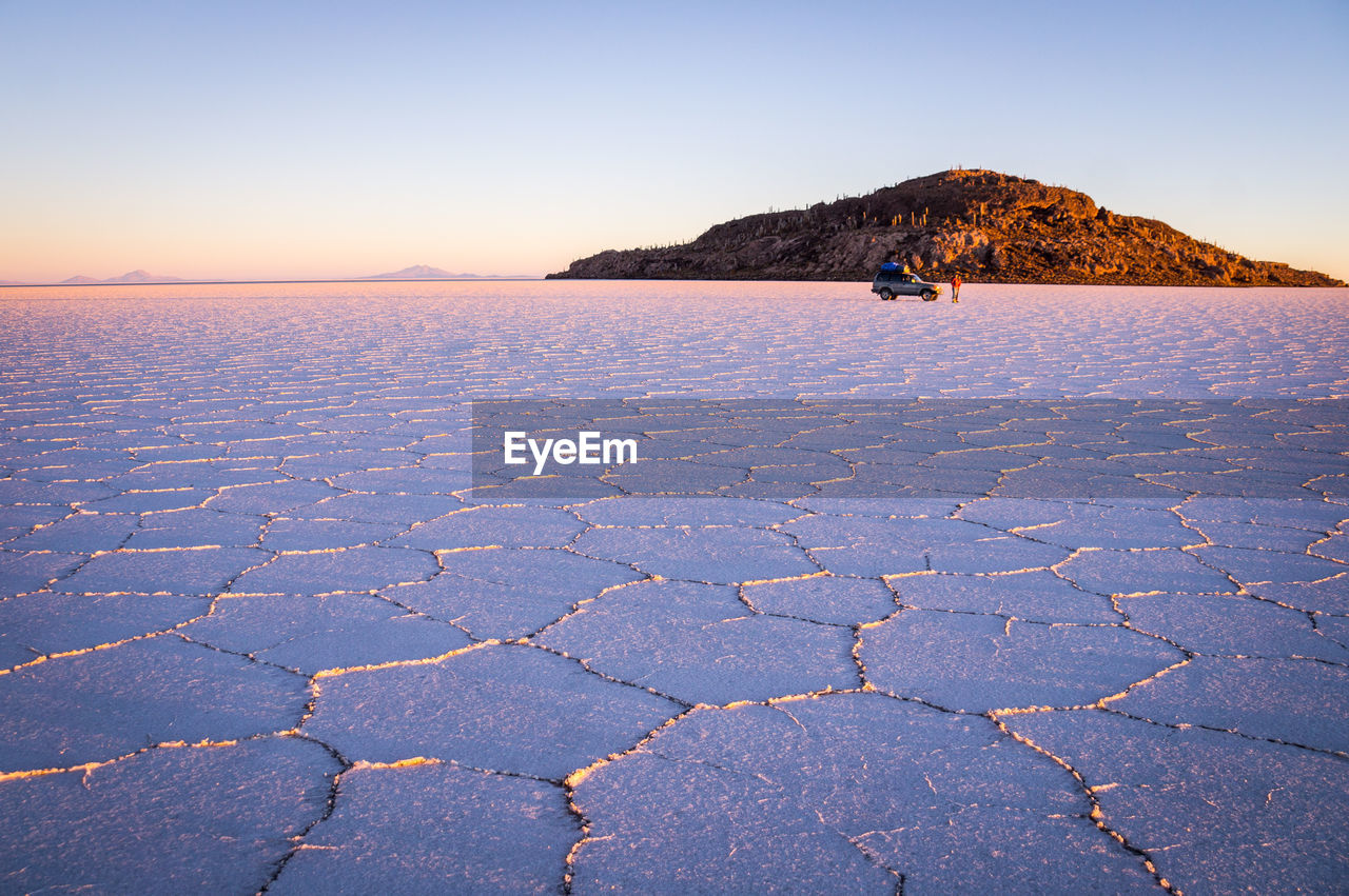 SCENIC VIEW OF SHORE AGAINST SKY