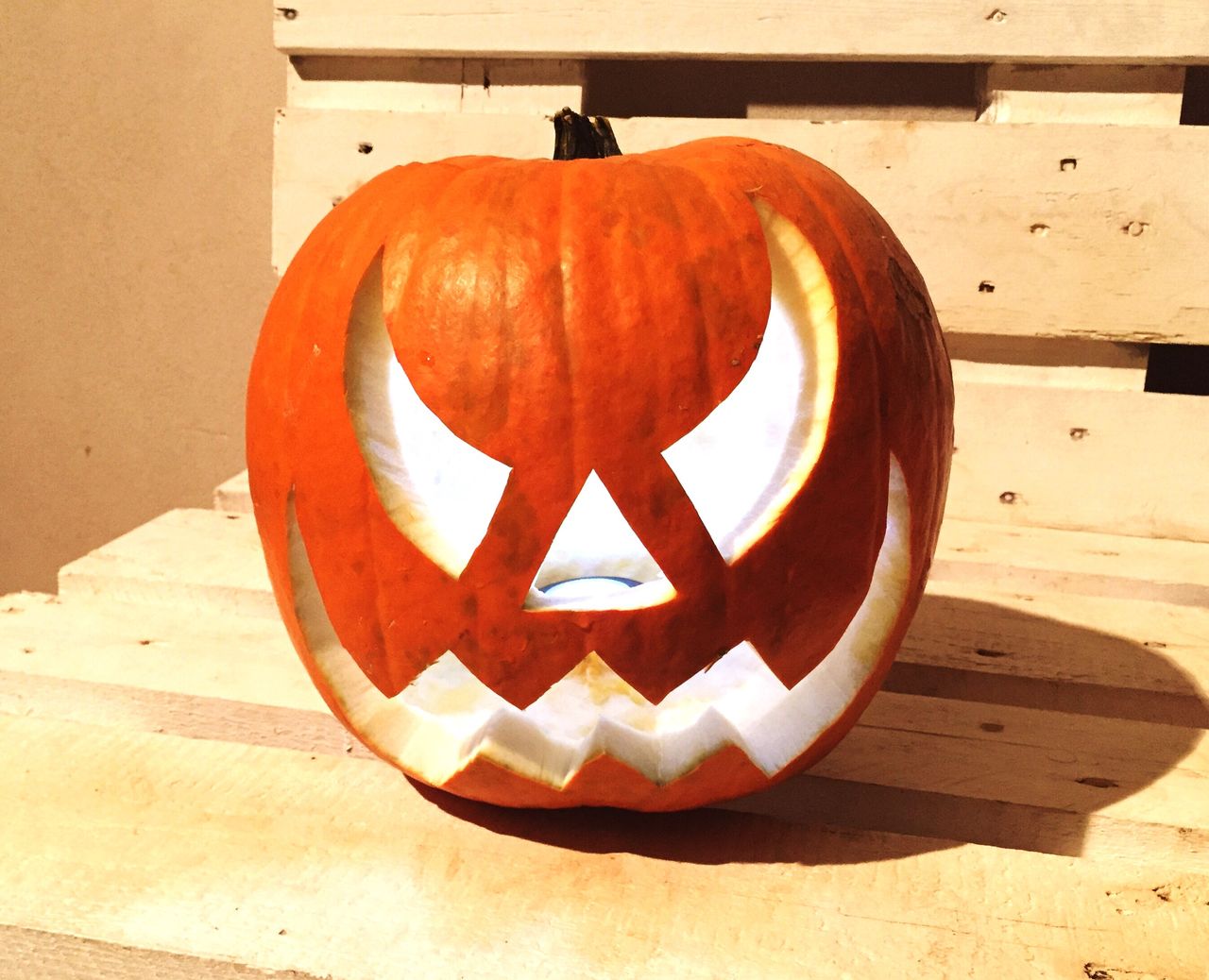 CLOSE-UP OF FACE ON STONE WALL WITH HALLOWEEN