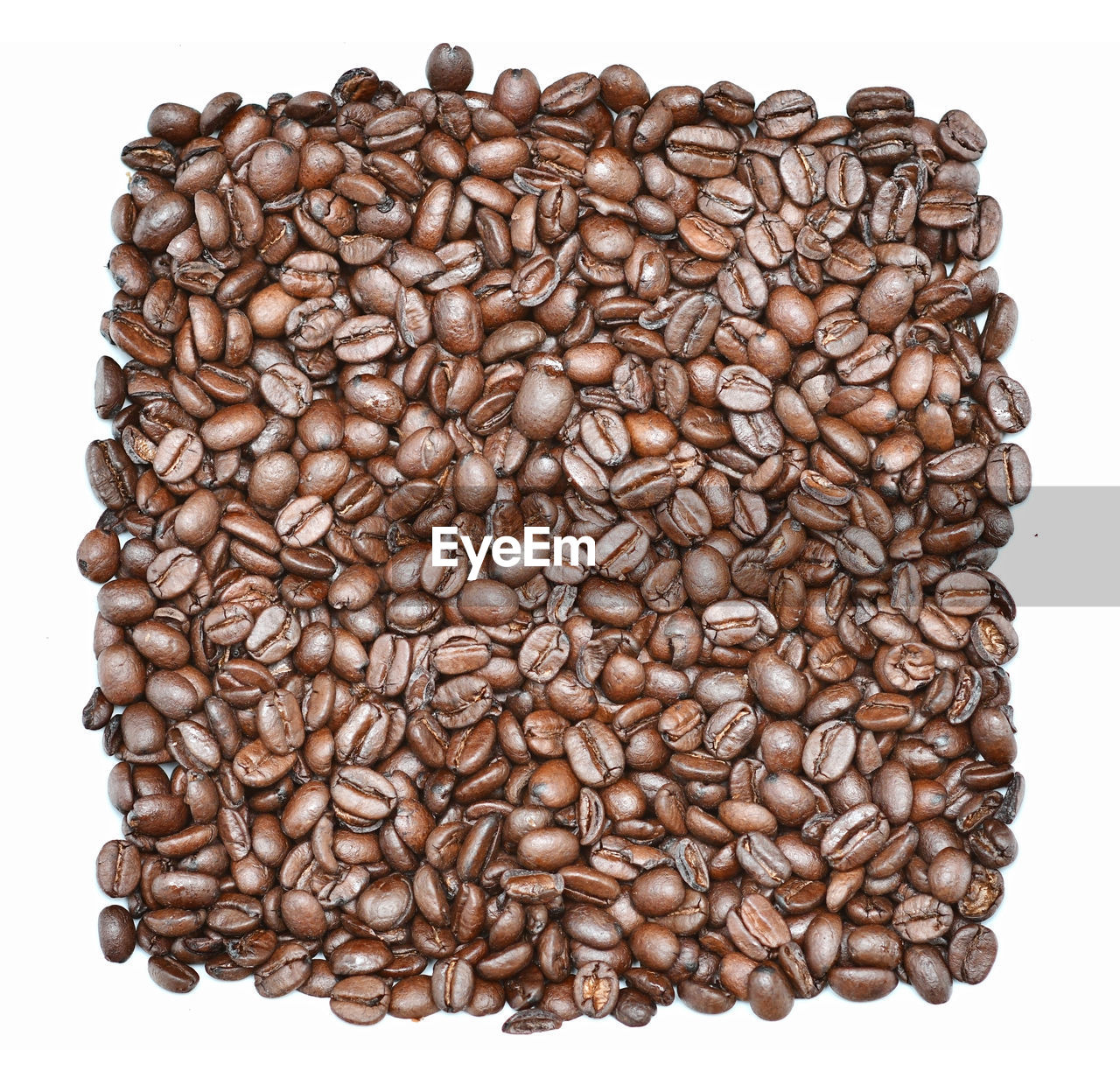Roasted coffee beans background or wallpaper. a stimulant contains caffeine and is a tasty drink