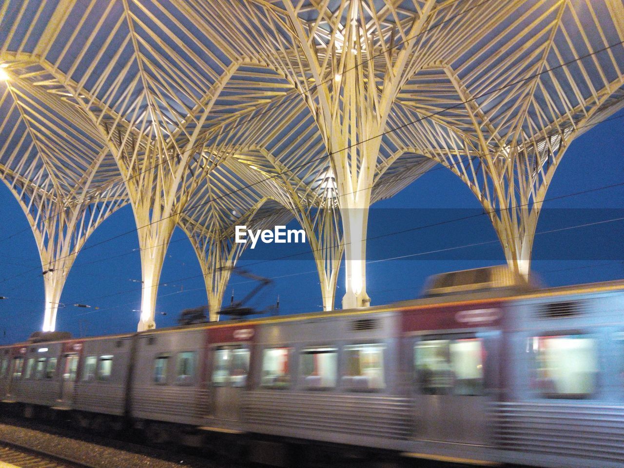 Train moving on tracks at railroad station