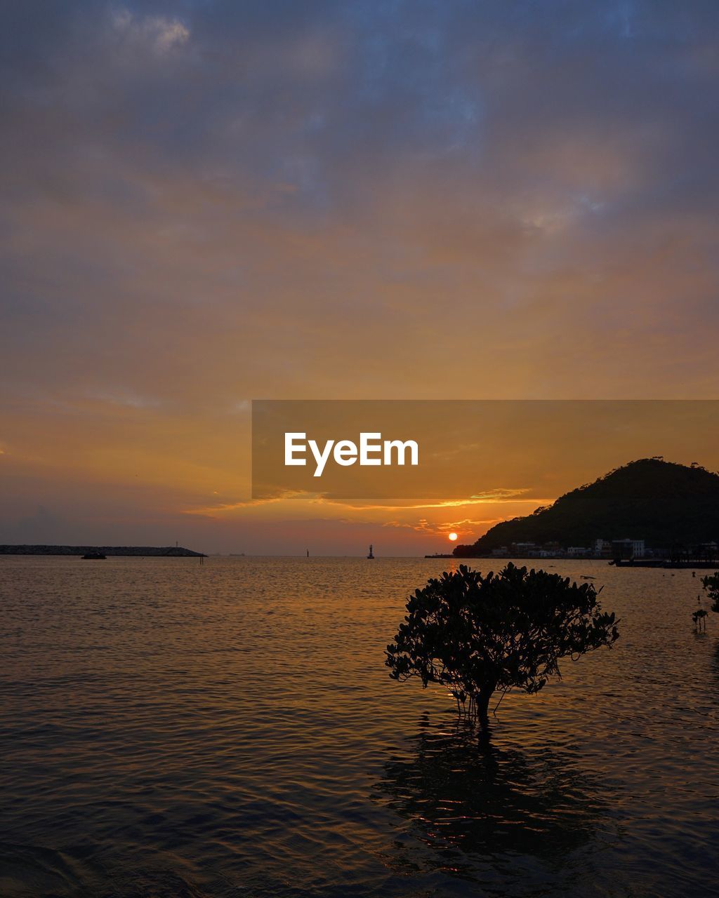 View of calm sea at sunset
