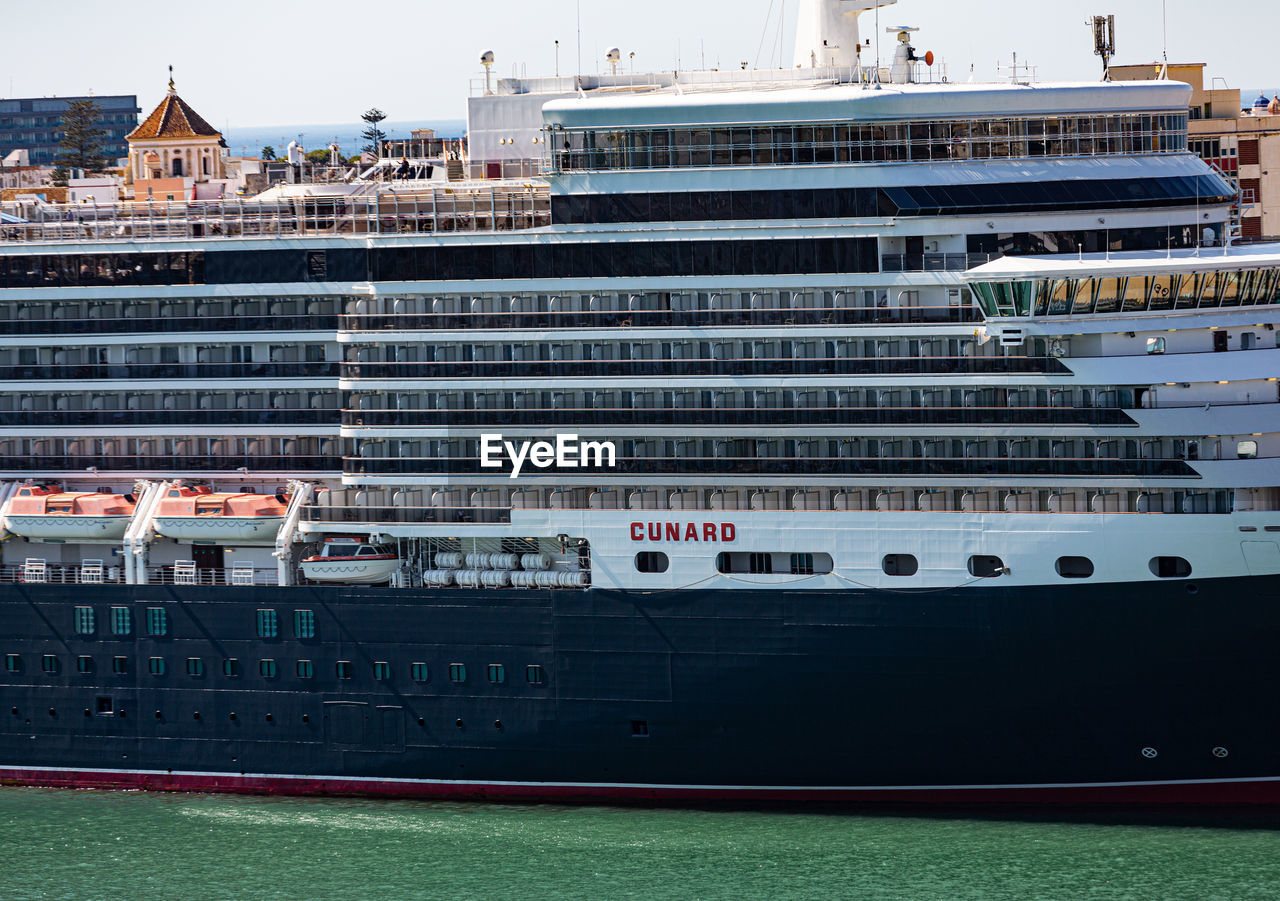 VIEW OF SHIP MOORED IN CITY