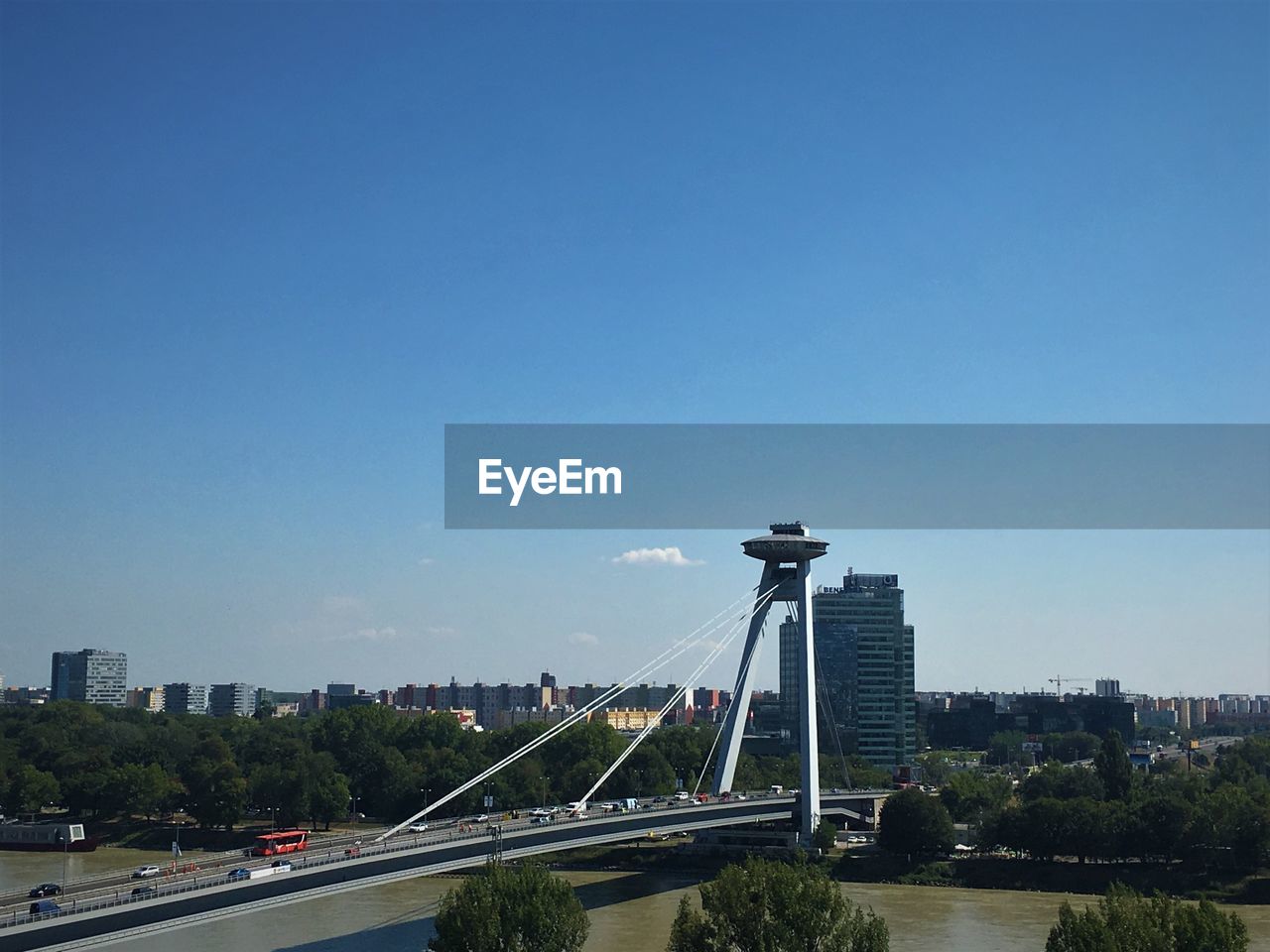 View of cityscape against clear blue sky