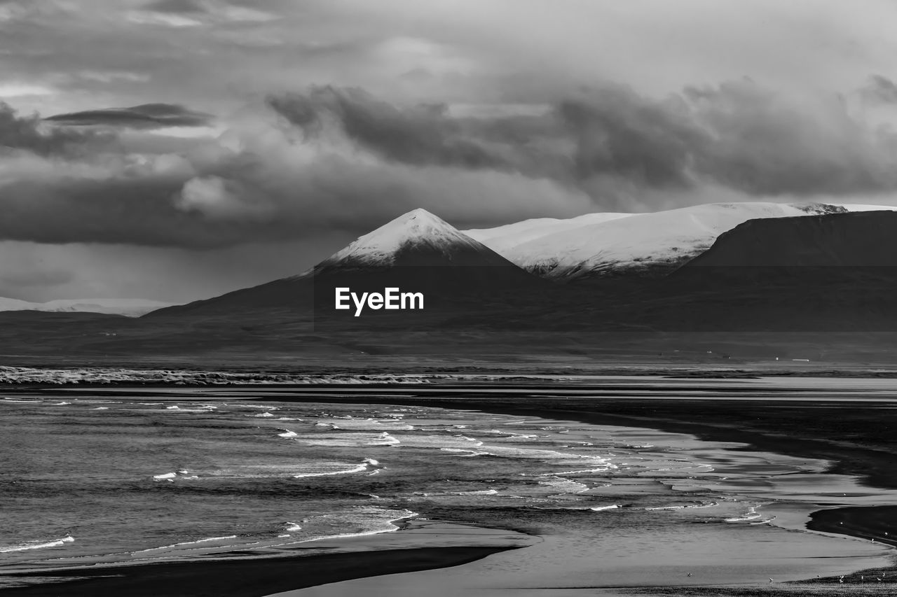 SCENIC VIEW OF MOUNTAINS AGAINST SKY DURING WINTER