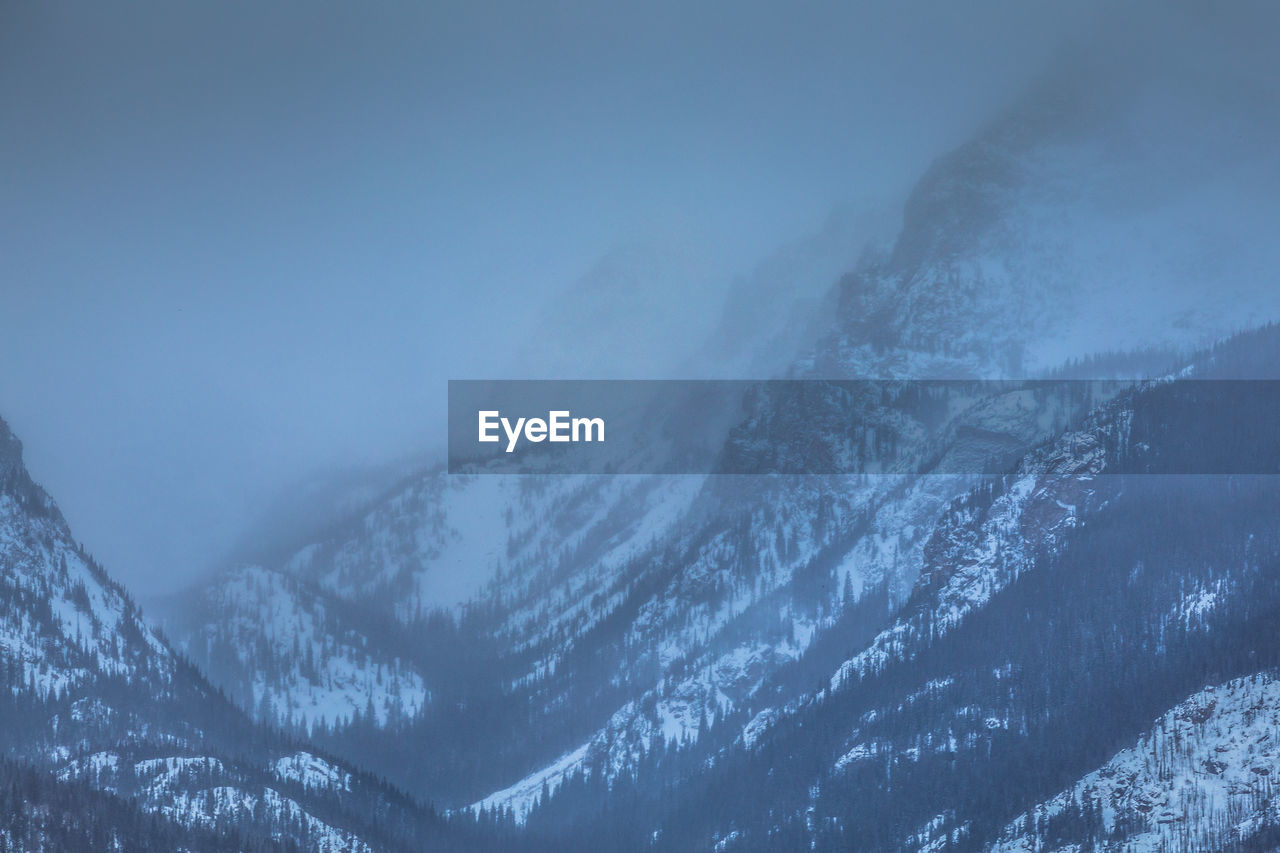 AERIAL VIEW OF SNOWCAPPED MOUNTAINS