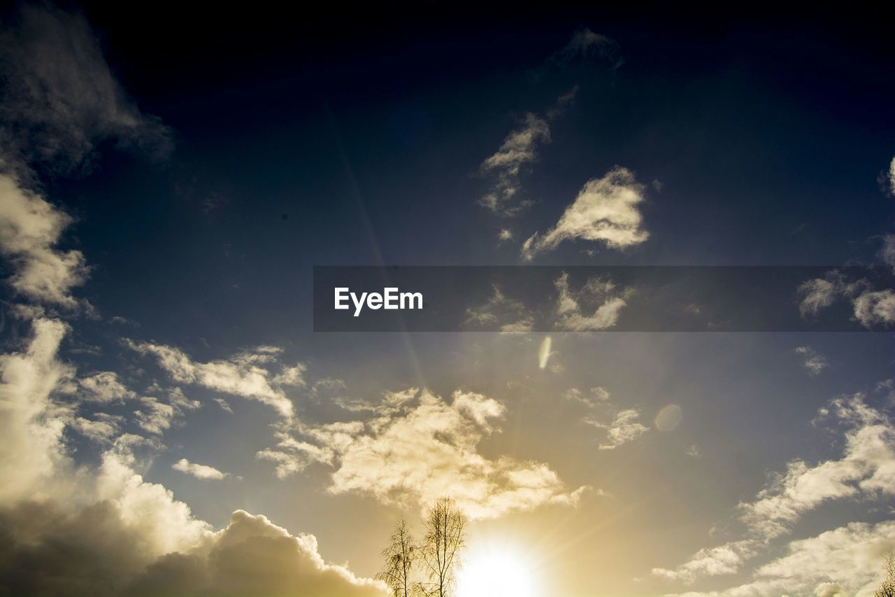 LOW ANGLE VIEW OF CLOUDS IN SKY AT SUNSET