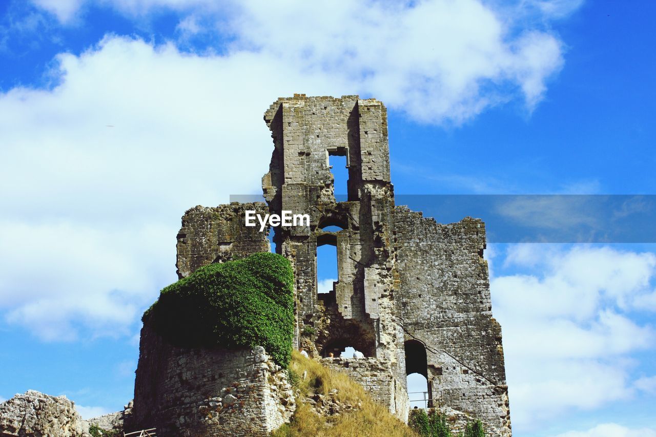 Low angle view of corfe castle against sky