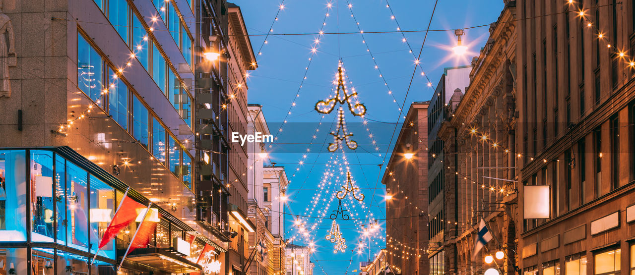 low angle view of illuminated buildings in city