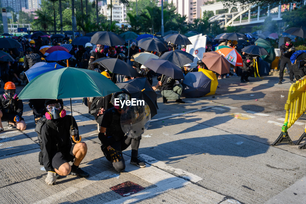 Protesters protesting on road in city