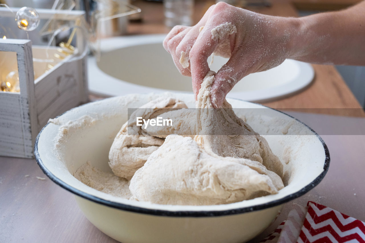 cropped hand of man preparing food