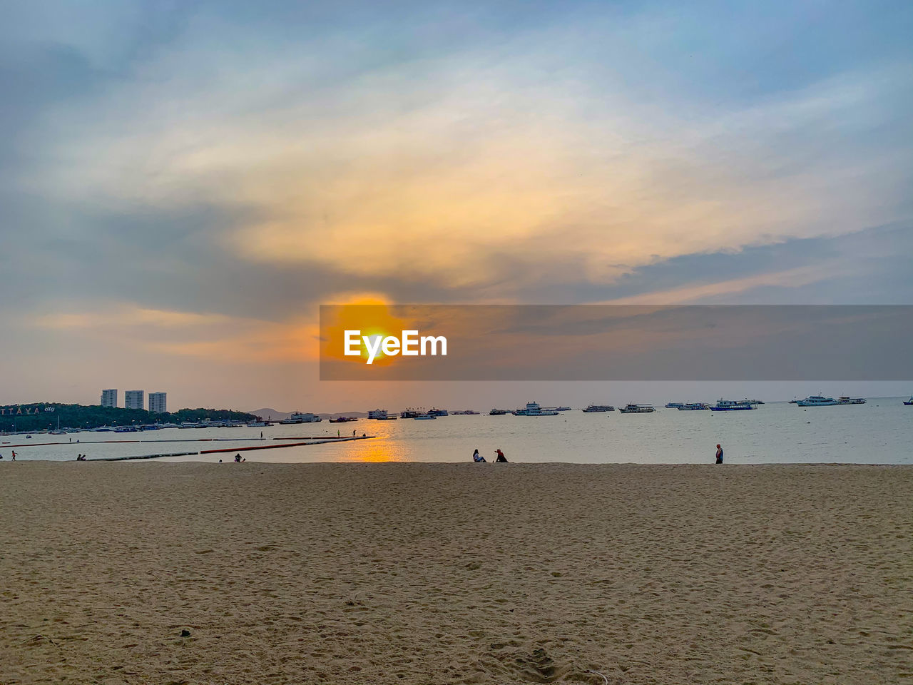 SCENIC VIEW OF BEACH DURING SUNSET
