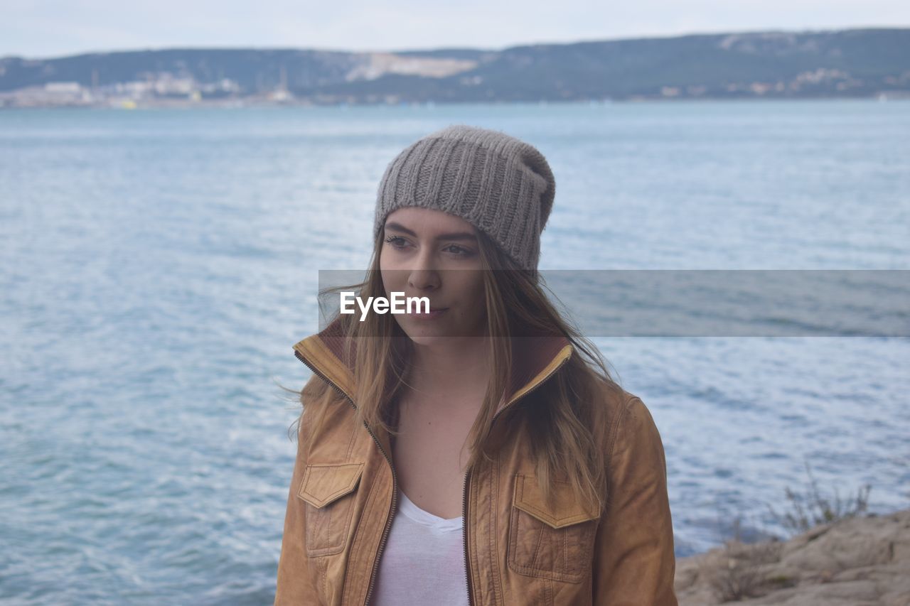 Beautiful woman by sea