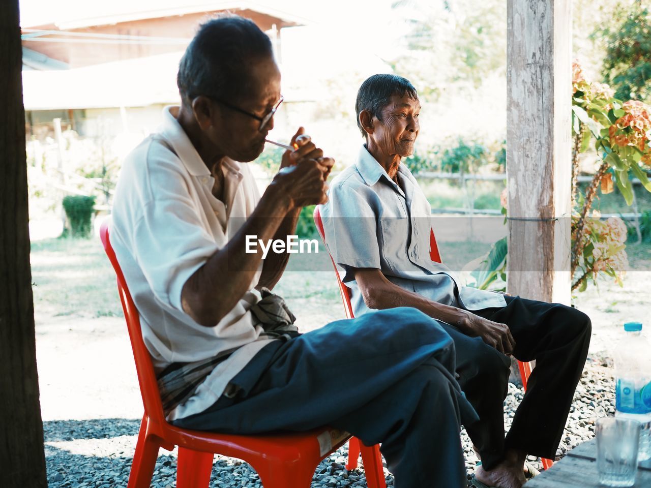 MEN SITTING ON SEAT