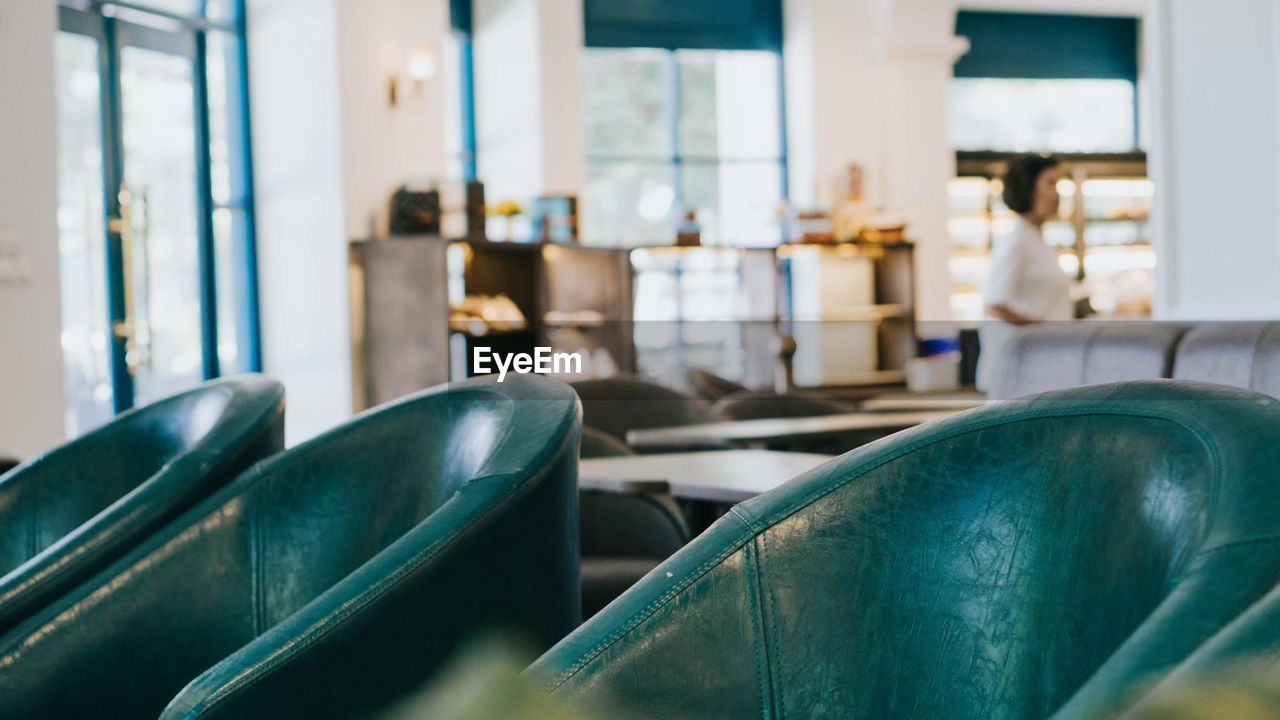 Close-up of empty chairs and table