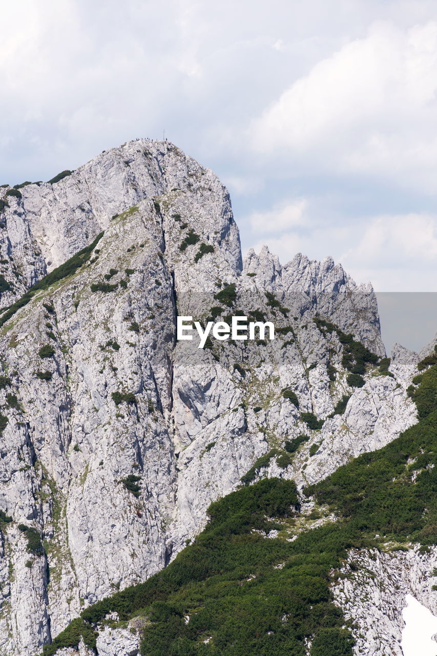 LOW ANGLE VIEW OF ROCK FORMATIONS AGAINST SKY