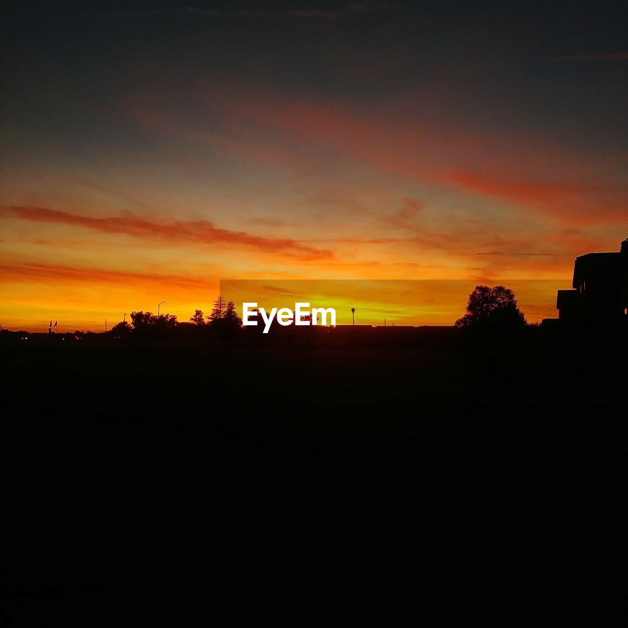 SCENIC VIEW OF SILHOUETTE LANDSCAPE AGAINST DRAMATIC SKY