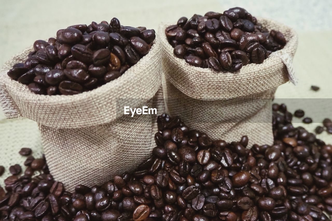 HIGH ANGLE VIEW OF COFFEE BEANS IN GLASS