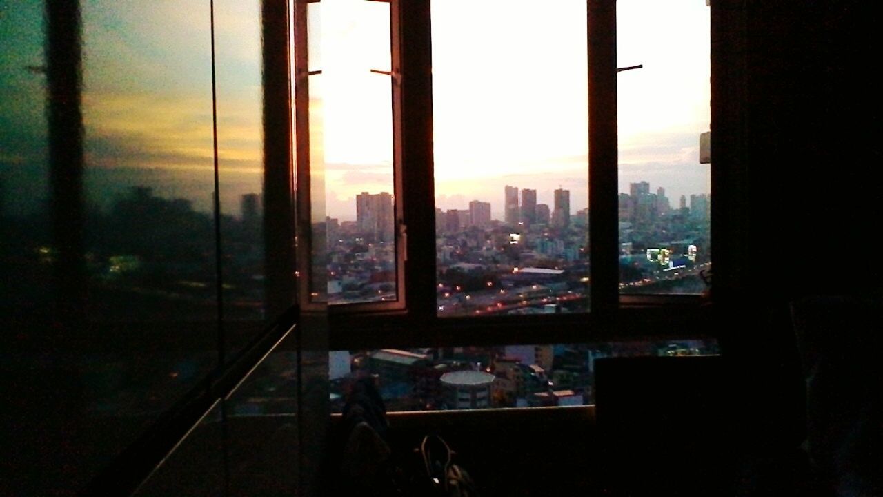 VIEW OF CITYSCAPE AT DUSK