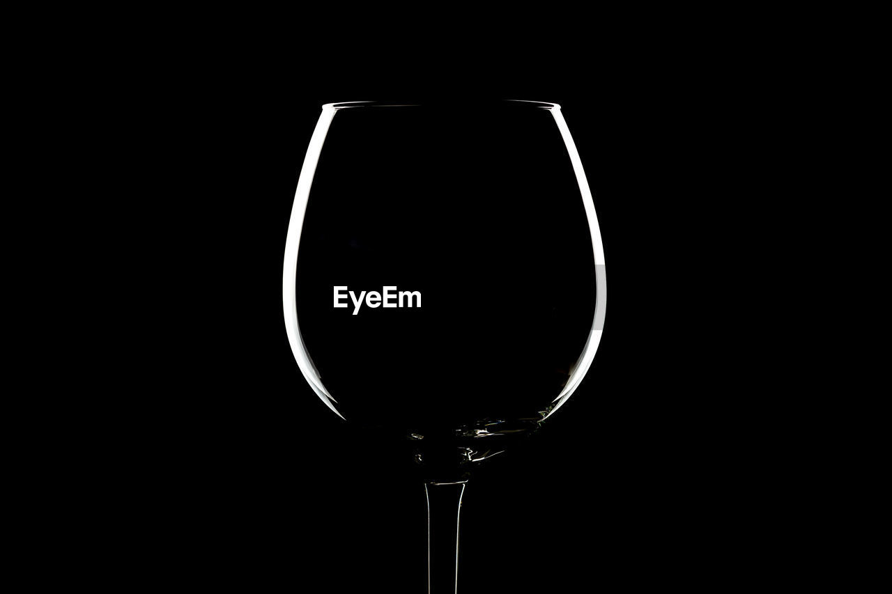 Close-up of drinking glass against black background