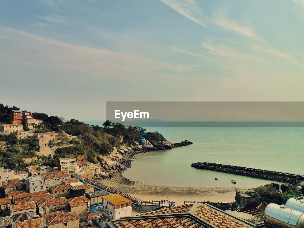 water, sea, sky, coast, architecture, building exterior, nature, built structure, ocean, horizon, beach, shore, land, building, scenics - nature, cloud, vacation, horizon over water, city, beauty in nature, travel destinations, bay, no people, high angle view, outdoors, residential district, day, house, travel, tranquility, tourism, sunlight, dusk, transportation, aerial photography, sunset, tranquil scene, roof, coastline, nautical vessel