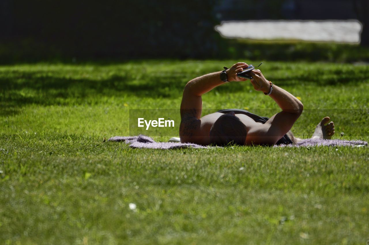 Man lying down on field