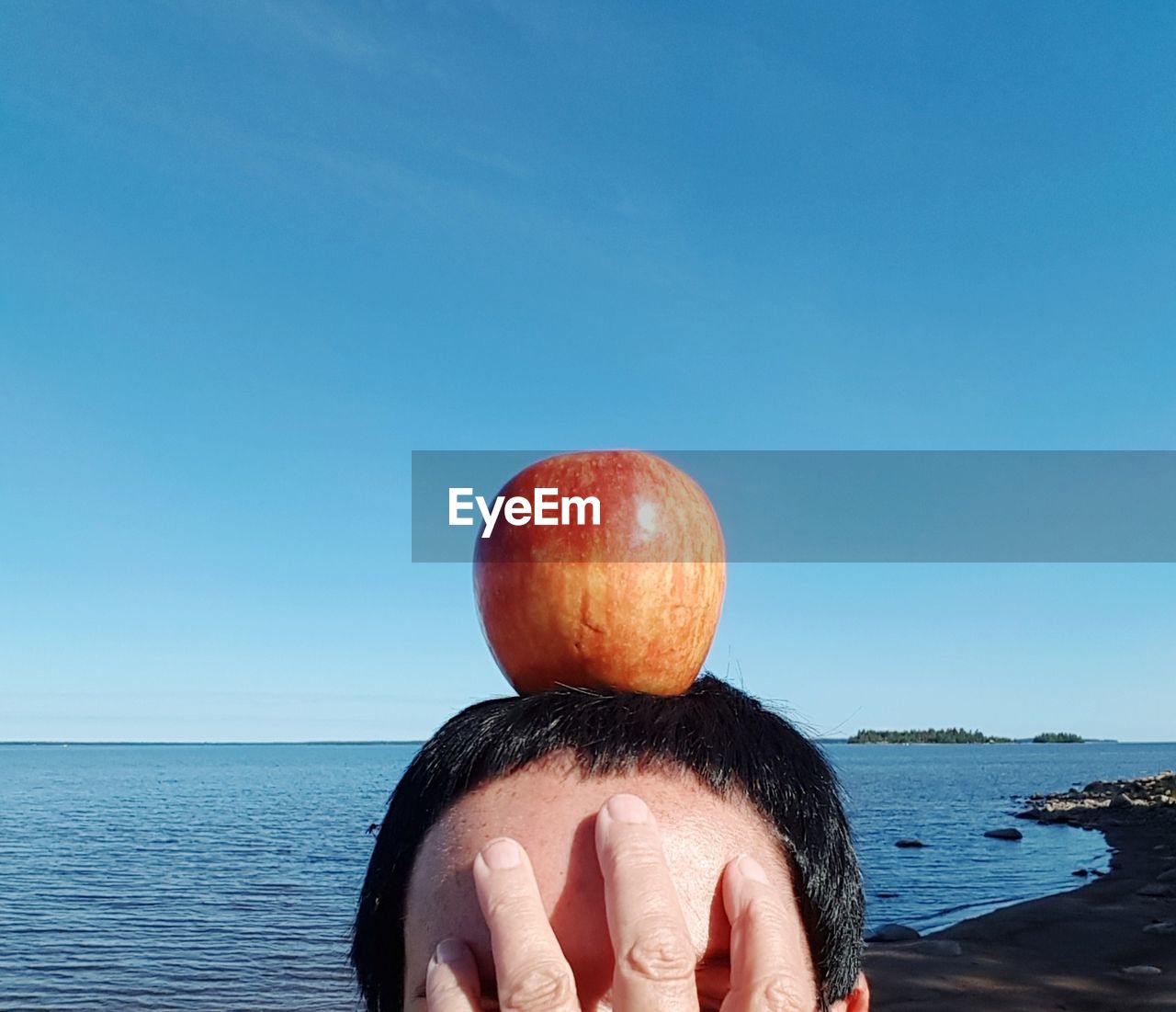 PORTRAIT OF MAN IN SEA AGAINST SKY