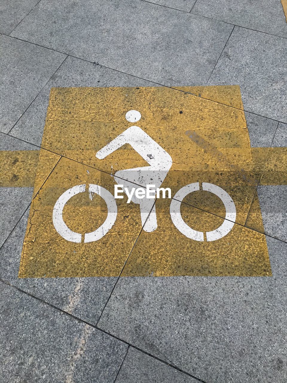 High angle view of bicycle lane sign on road