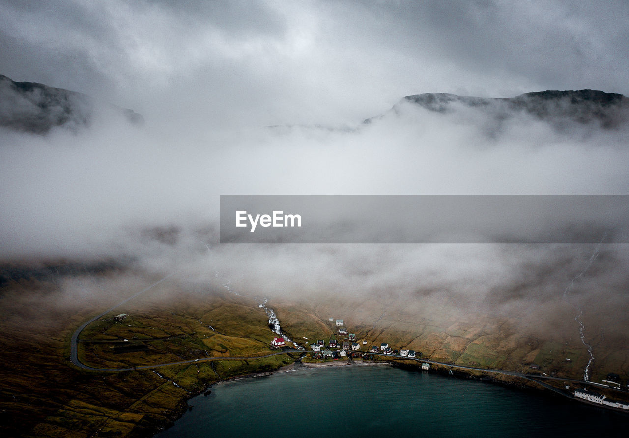 Scenic view of mountain against cloudy sky