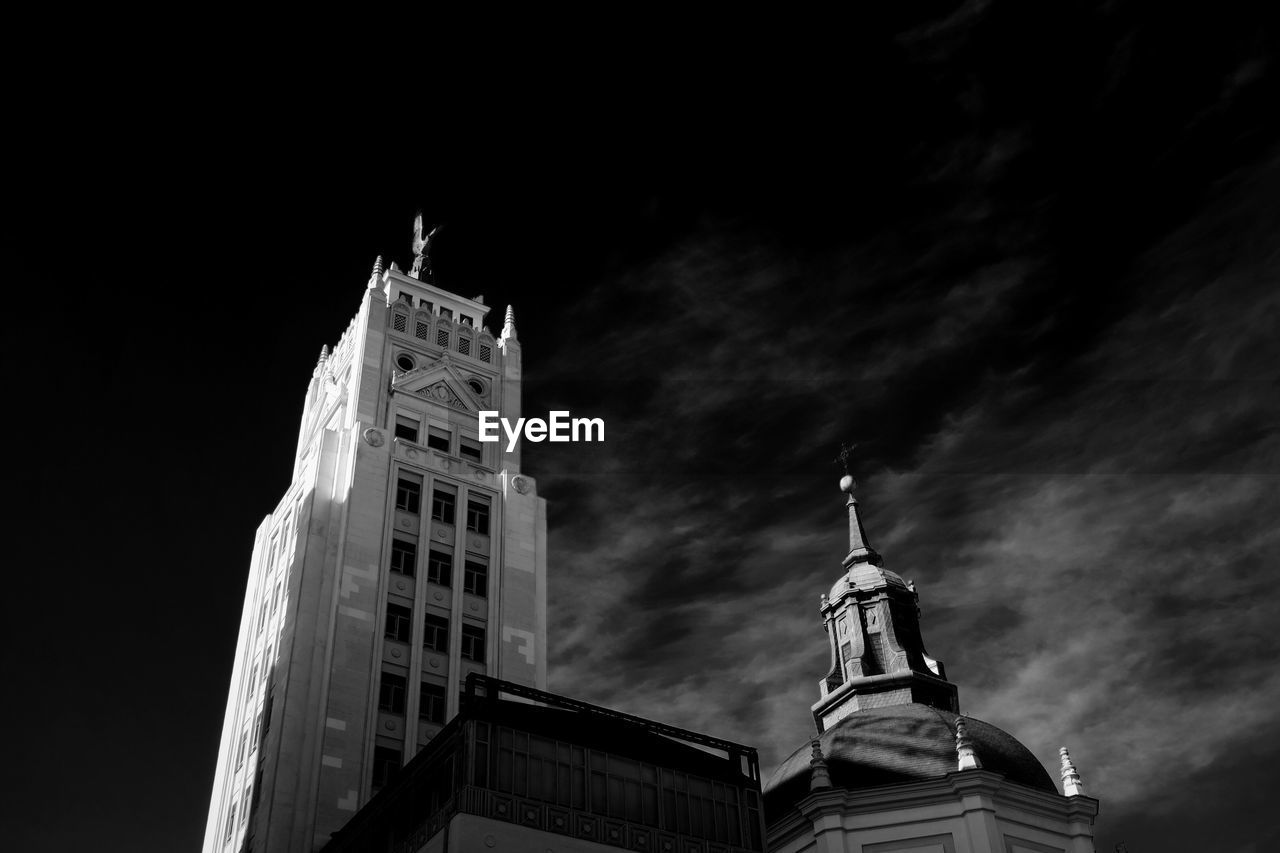 Low angle view of towers against sky