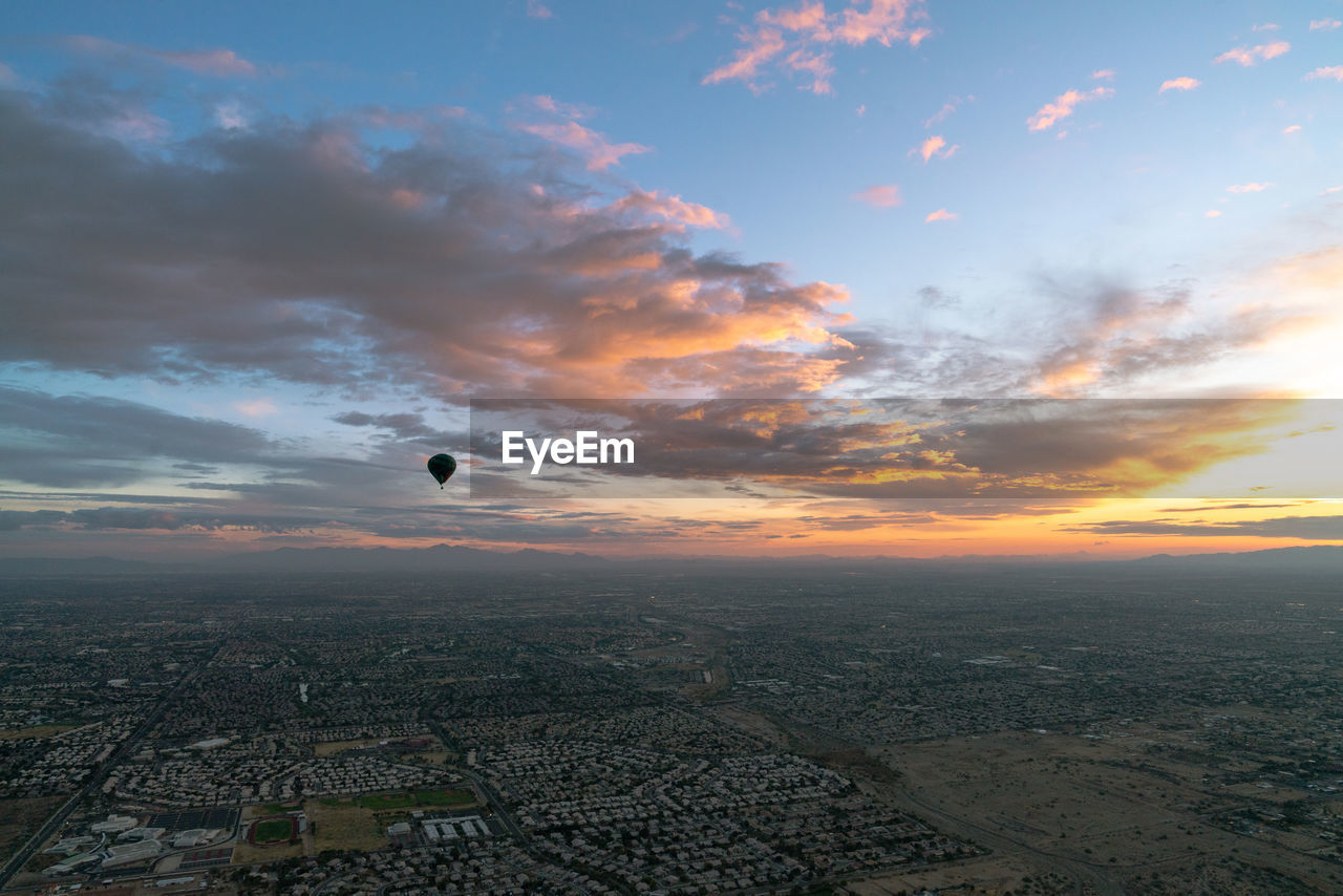 SCENIC VIEW OF ORANGE SKY OVER CITY