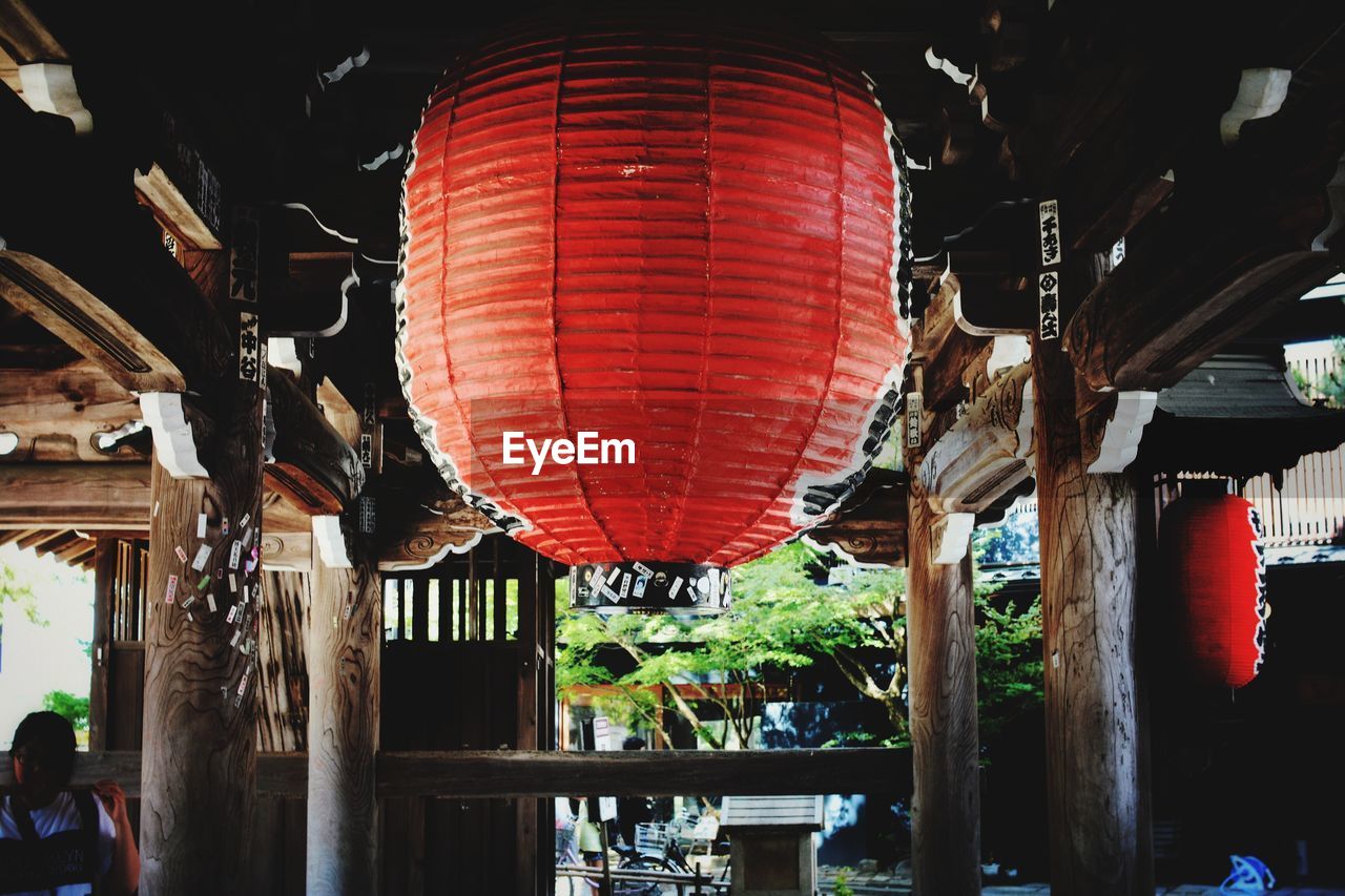 LOW ANGLE VIEW OF ILLUMINATED LANTERNS HANGING