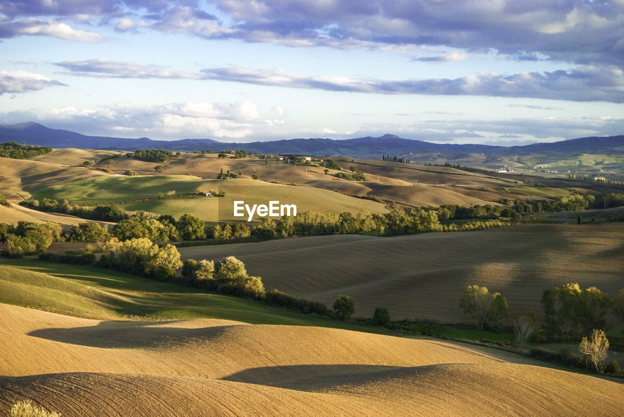 Scenic view of mountains against cloudy sky