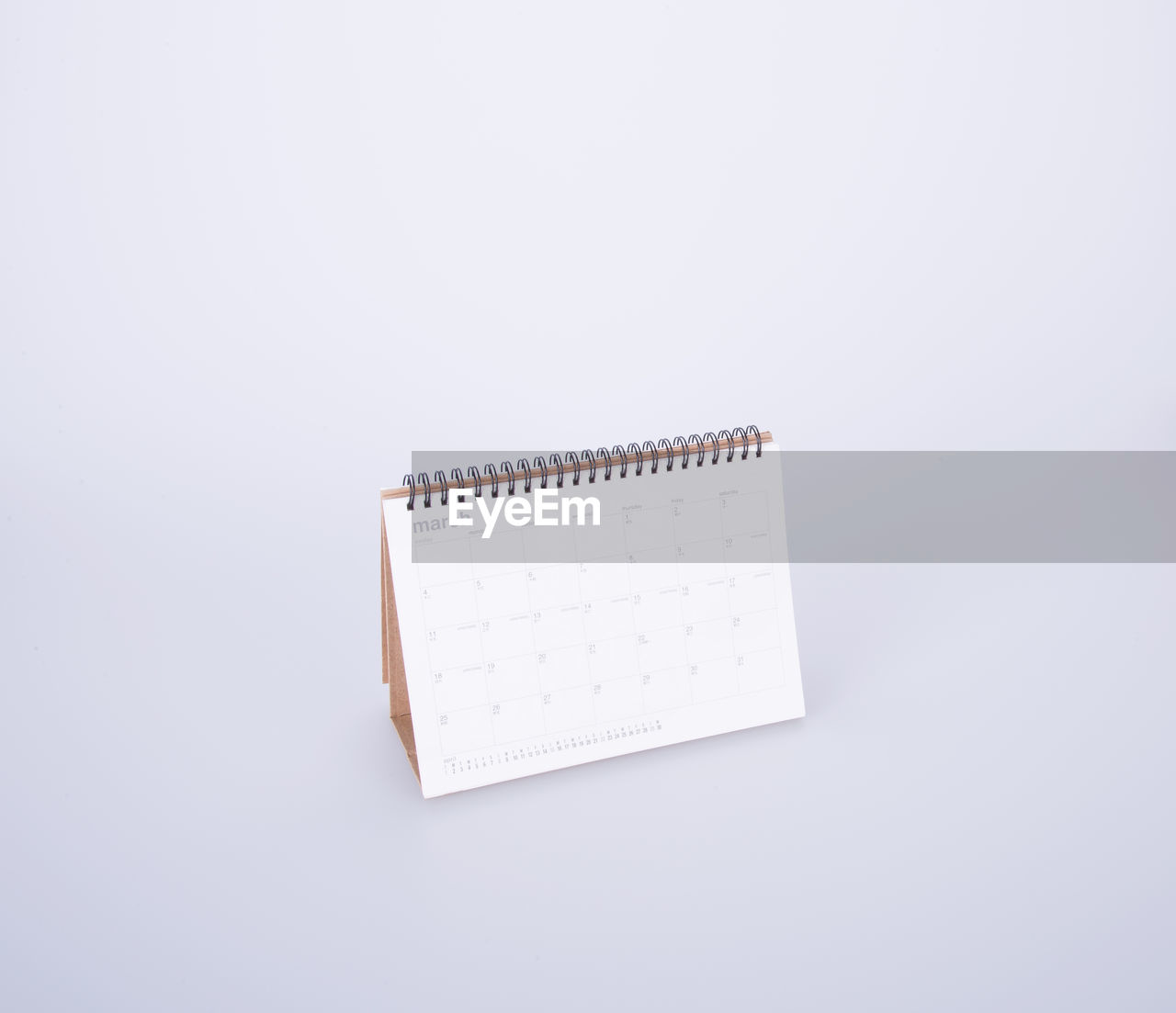 HIGH ANGLE VIEW OF PAPER FLAG ON WHITE