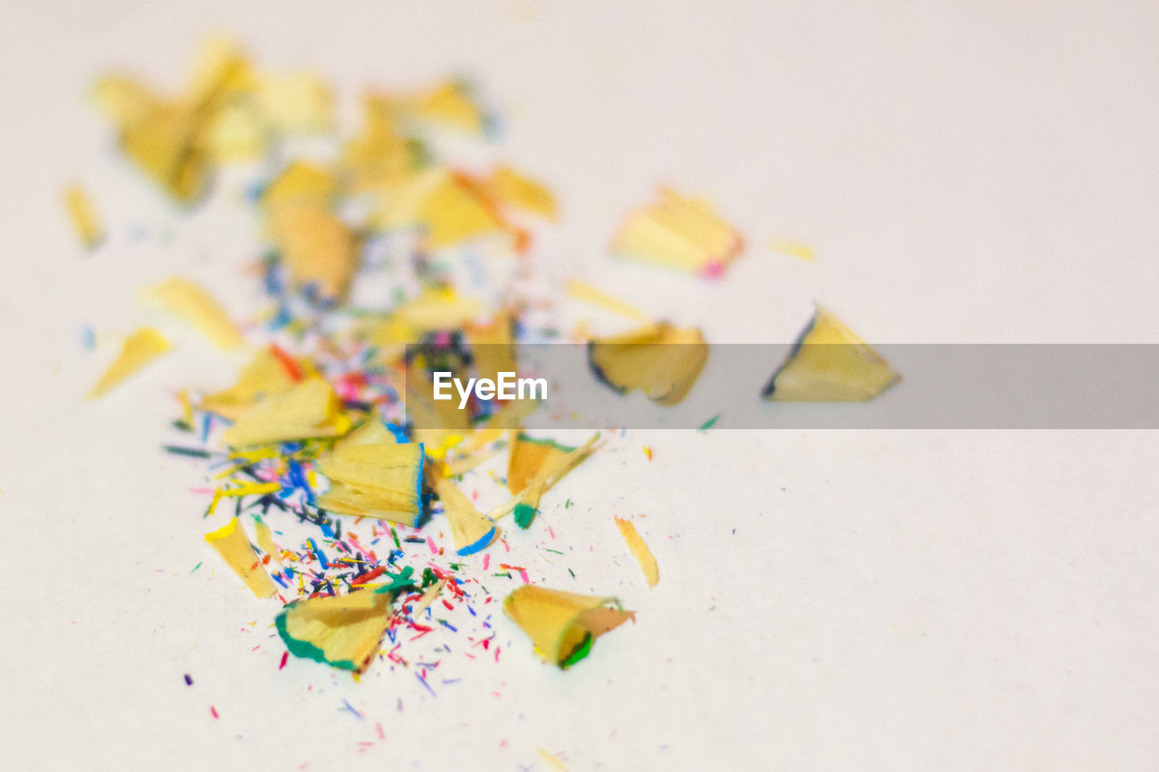 Close-up of pencil shavings against white background
