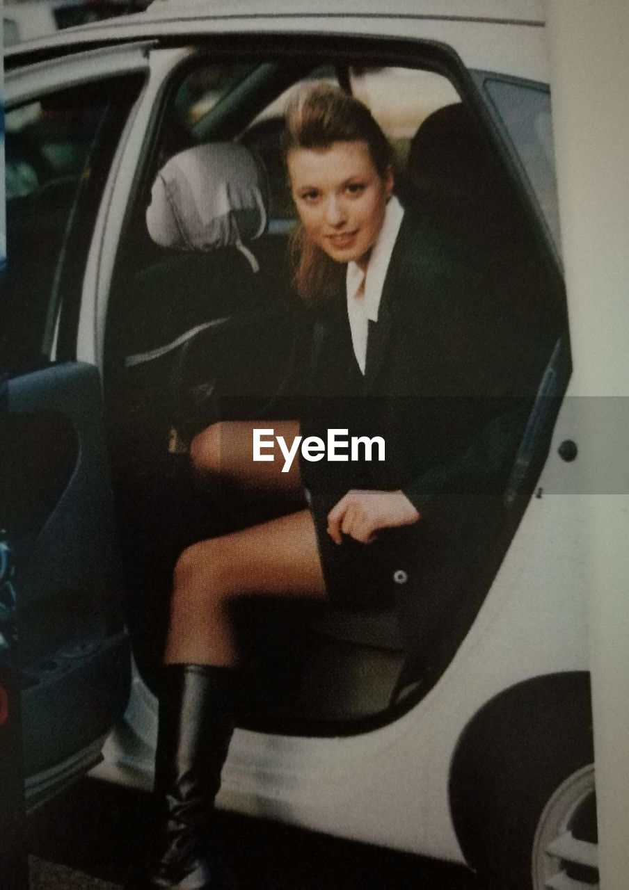 WOMAN SITTING IN BUS