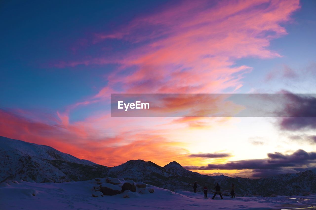 Scenic view of mountains against sky during sunset